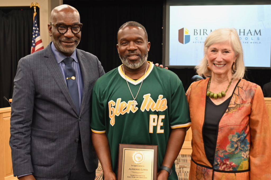 Dr. Mark Sullivan, ASAHPERD Sports Professional of the Year Alphonzo Lewis of Glen Iris Elementary, and Board Member Mary Boehm