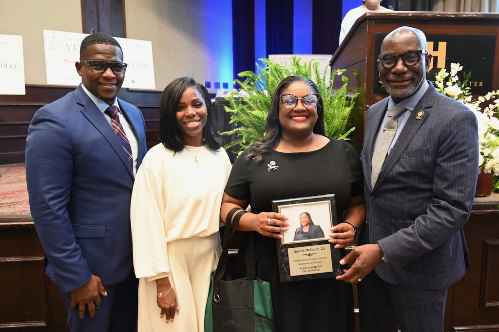 Board President Sherman Collins, Board Member Yamika Foy, NBCT Brandi McGuire, and Superintendent Dr. Mark Sullivan