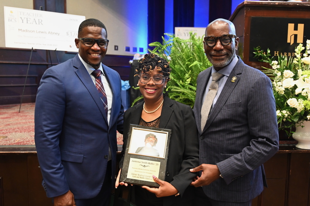 Board President Sherman Collins, NBCT Janessa Smith-Waller, and Superintendent Dr. Mark Sullivan