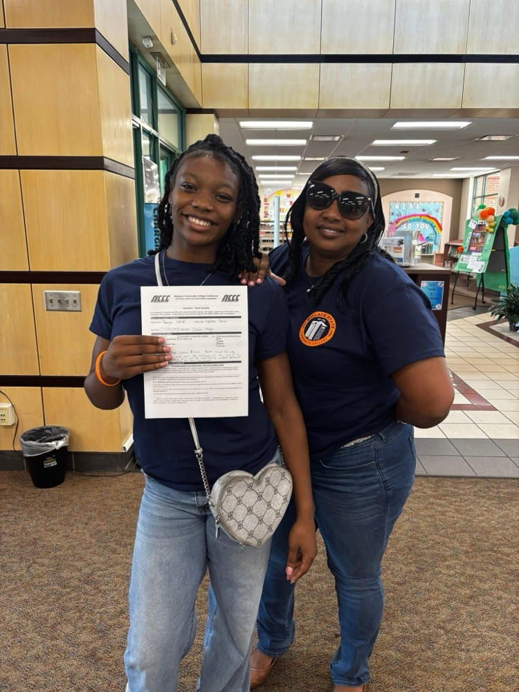 Tamya and mom after signing scholarship!