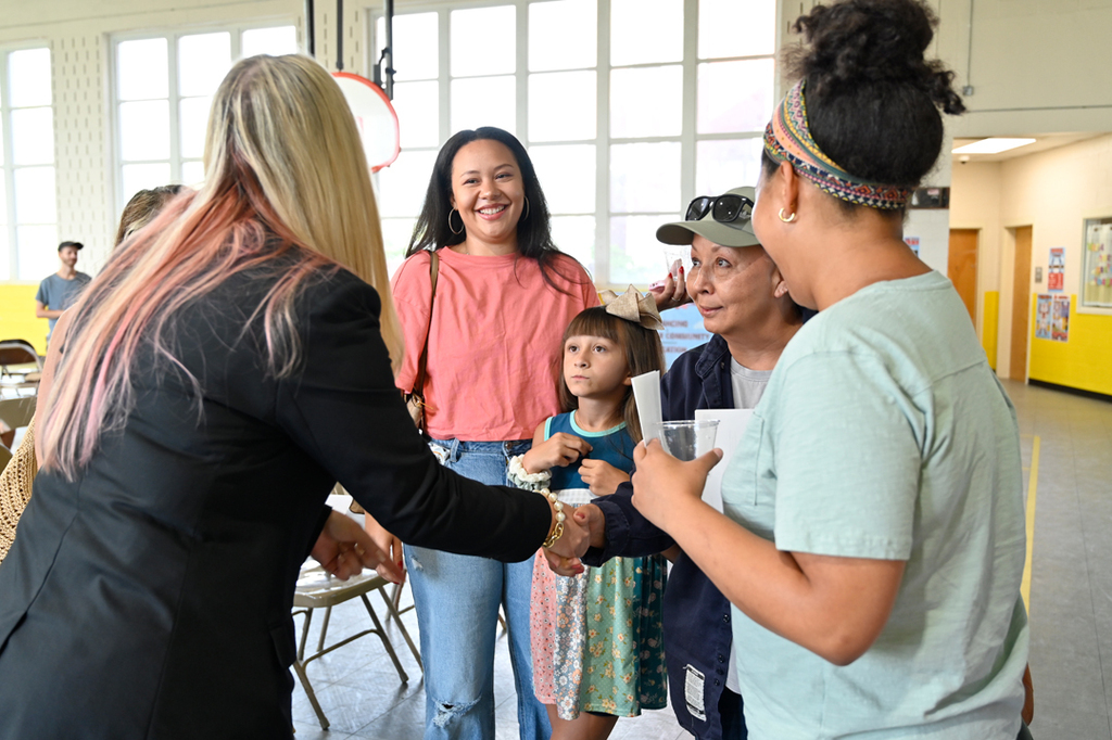 Avondale Principal Dr. Sabrina McGee greets a family.