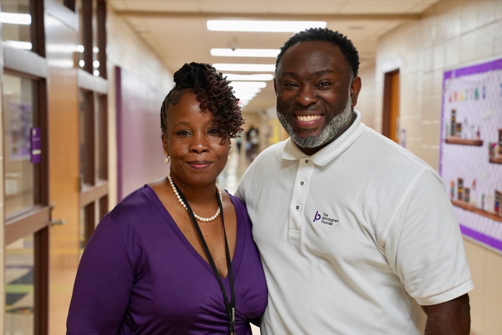Board Member Derrick Billups welcomes Principal Alicica' Washington to Inglenook