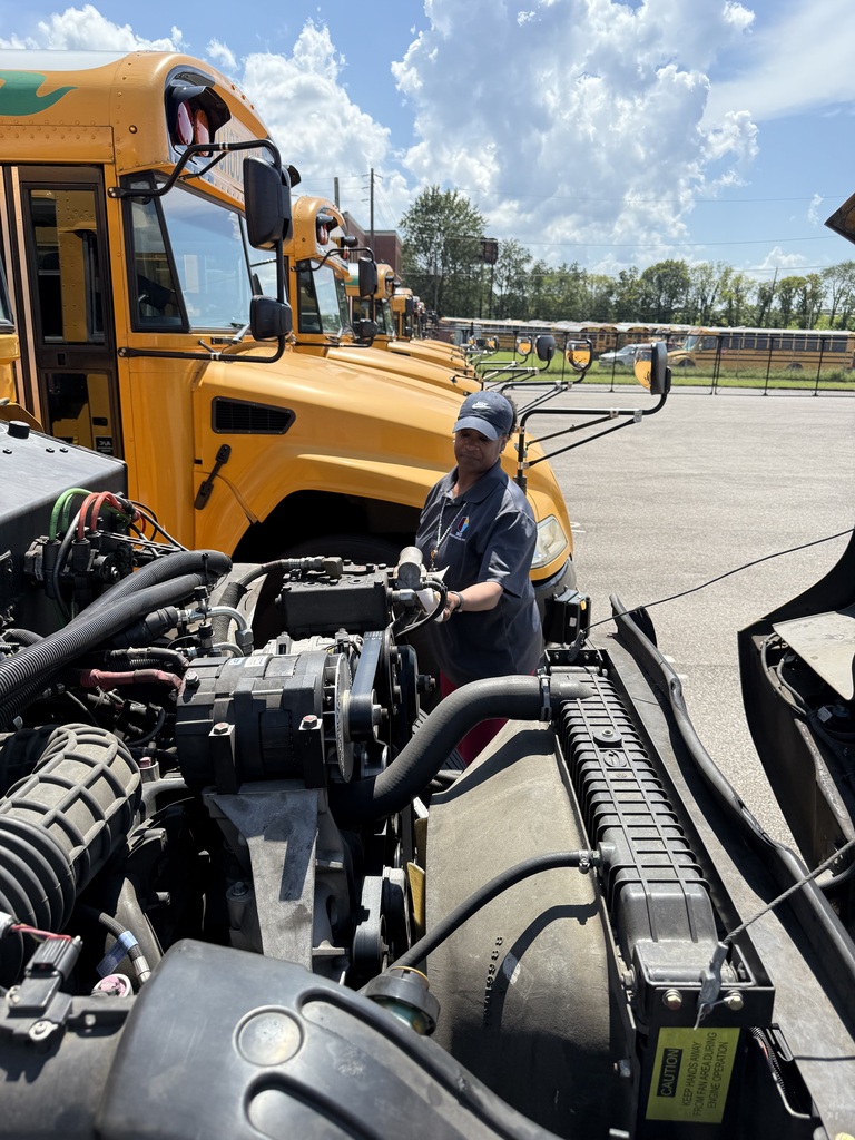 Ms. Smith works on a bus engine
