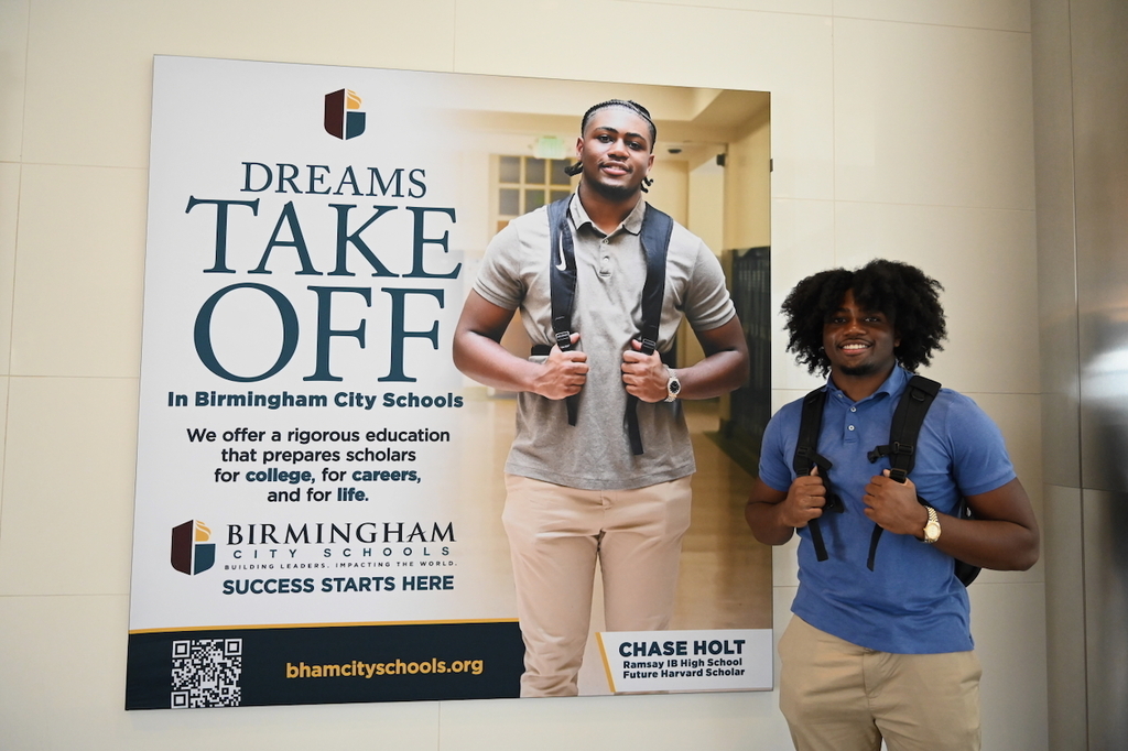 Ramsay's Chase Holt and his billboard at Birmingham-Shuttlesworth International Airport