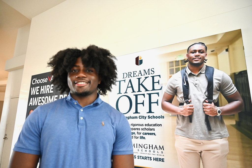 Ramsay's Chase Holt and his billboard at Birmingham-Shuttlesworth International Airport