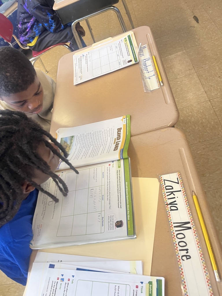 students working on a worksheet at desks