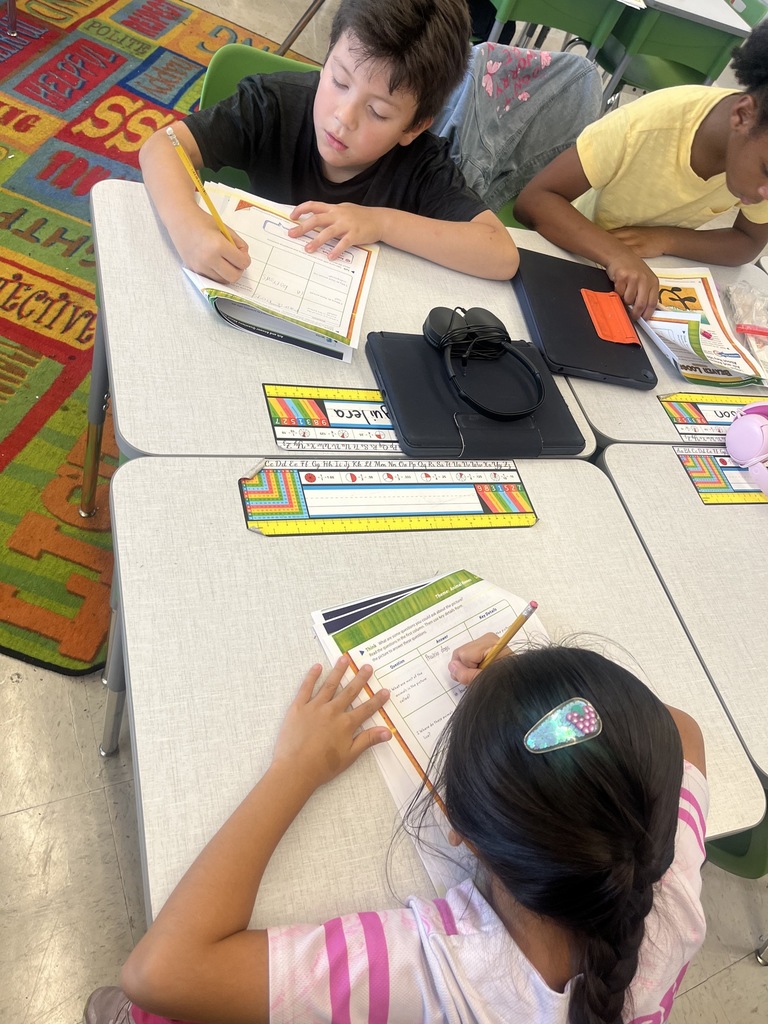 students working on a worksheet at desks