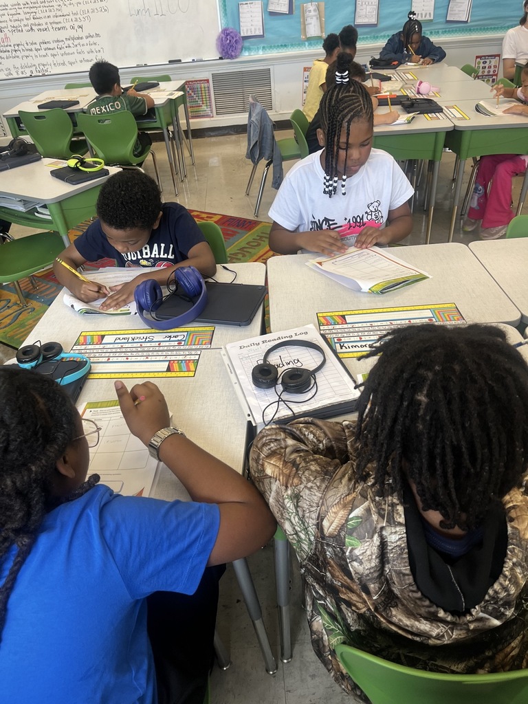 students working on a worksheet at desks