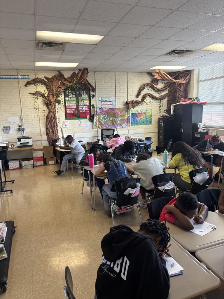 students working on a worksheet at desks