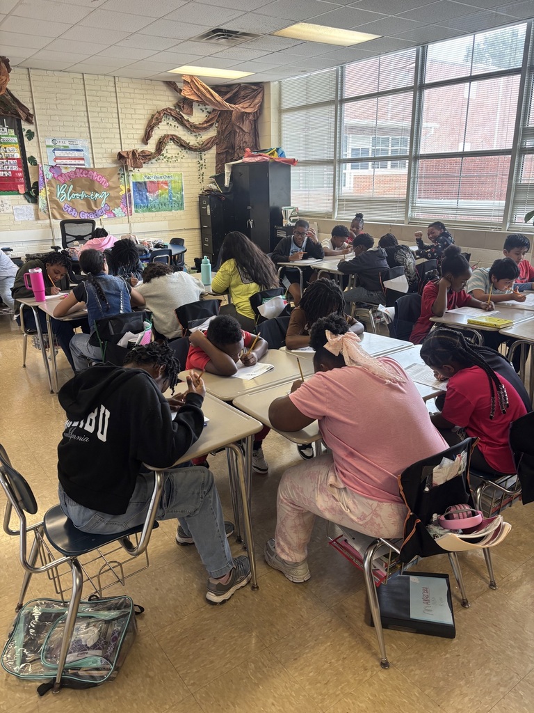 students working on a worksheet at desks
