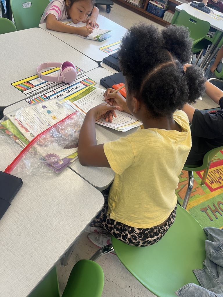 students working on a worksheet at desks