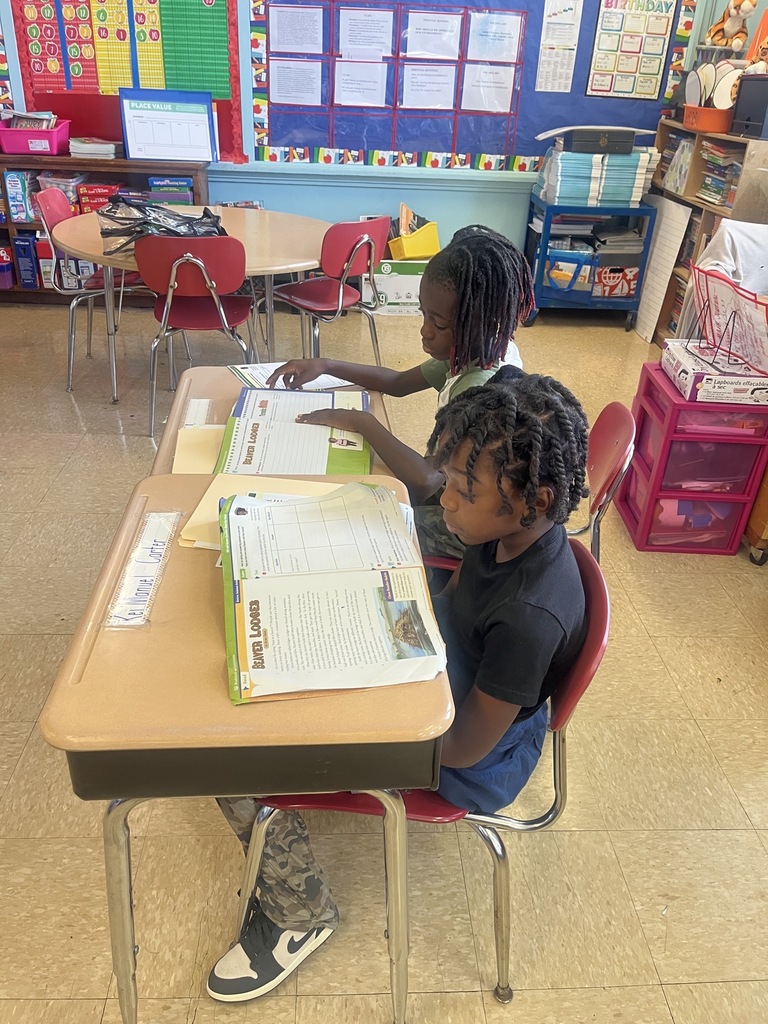 students working on a worksheet at desks