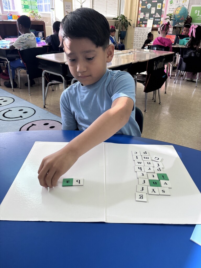 student working on word work