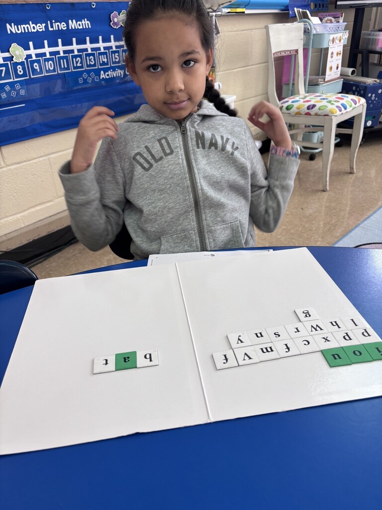 student working on word work