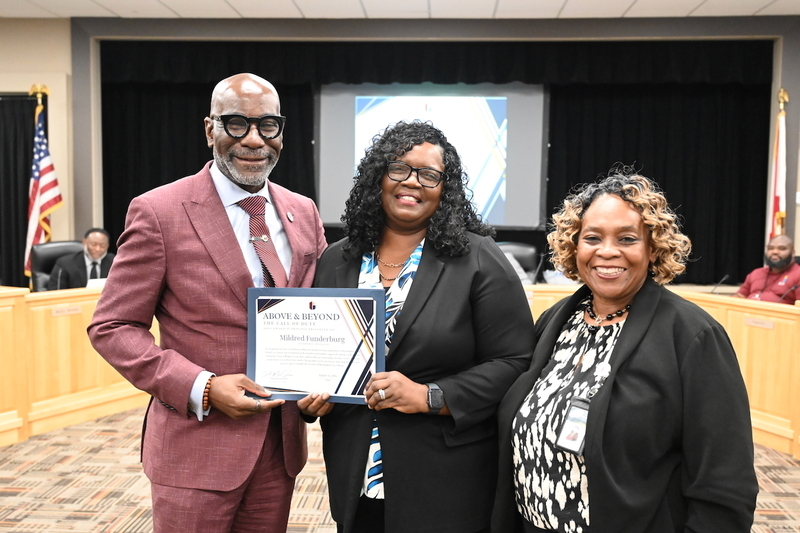 Superintendent Dr. Mark Sullivan, Mildred Funderberg, and Chief Academic Officer Dr. Pamela Williams