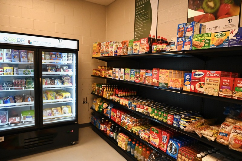 The store stocks fresh produce, pantry items, and frozen foods. 