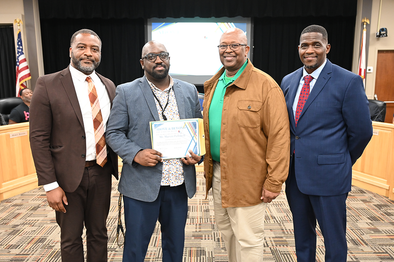 Chief of Staff Dr. Terry Lamar, Marvin Pullom and Principal Jeffrey Willis of Huffman Middle School, and Board Member Sherman Collins