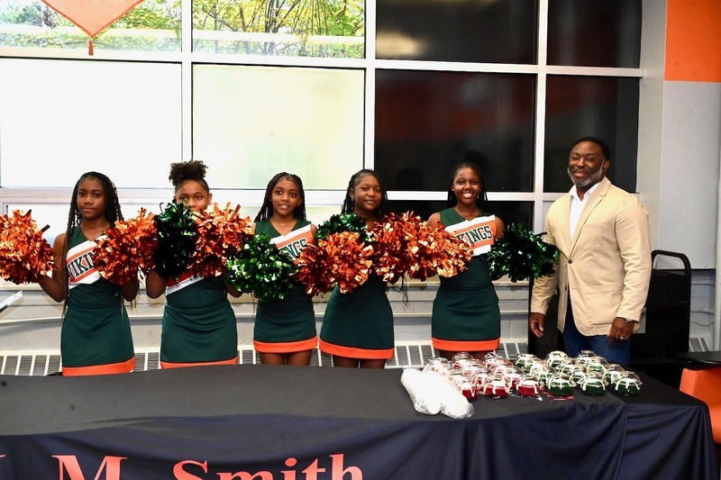 The Smith Middle Cheer Squad with Board Member Derrick Billups