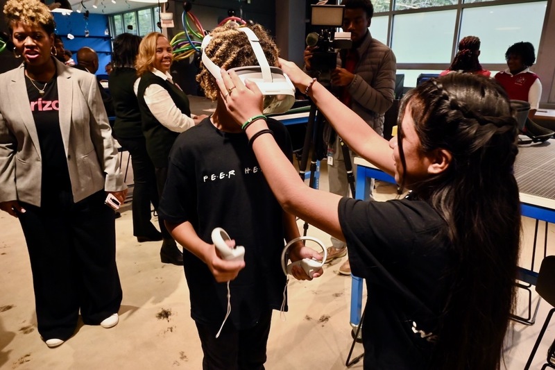 Scholars try on VR headsets