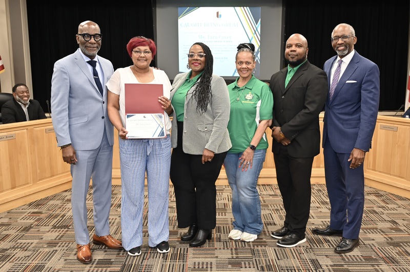 Tara Caver (second from left)