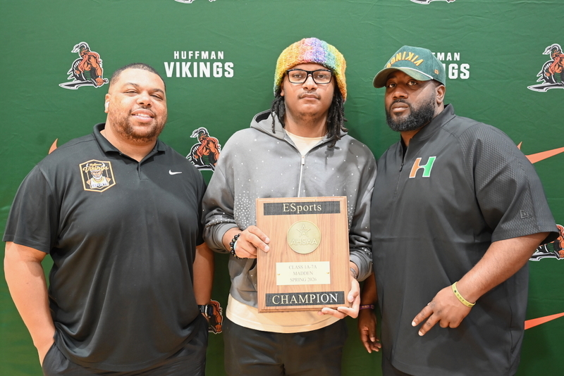 Coach Justin Hackett, Carlos Smith, Jr. and Head Football Coach Darrell Lebeaux