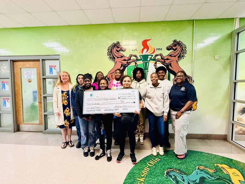 J.O. receives check for $500 from Litter Quitters competition