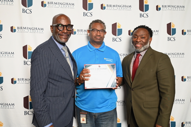 Superintendent Dr. Mark Sullivan, Norwood's James Anderson, and Board Member Derrick Billups