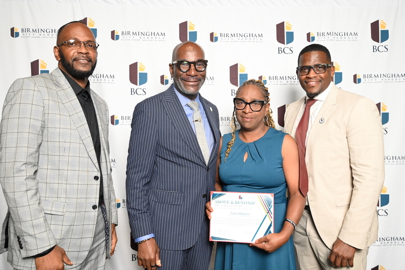 Martha Gaskins Principal Dr. Herbert Blackmon, Superintendent Dr. Mark Sullivan, Zora Harris of Martha Gaskins Elementary, Board President Sherman Collins