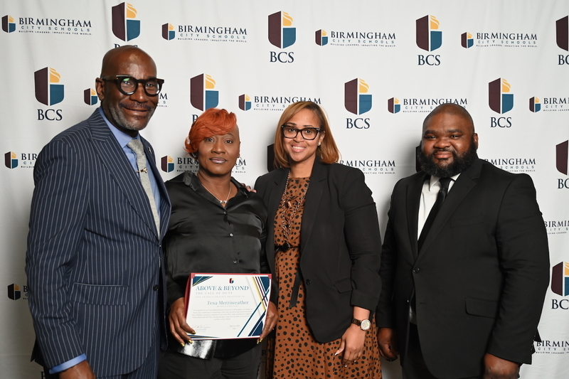 Superintendent Dr. Mark Sullivan, Brown Elementary's Tesa Merriweather and Principal Ja'Net Sharpe, Board Member Antwon Womack