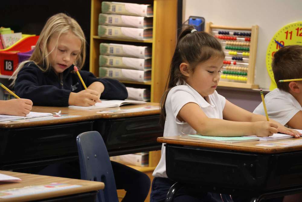 elementary students at desk
