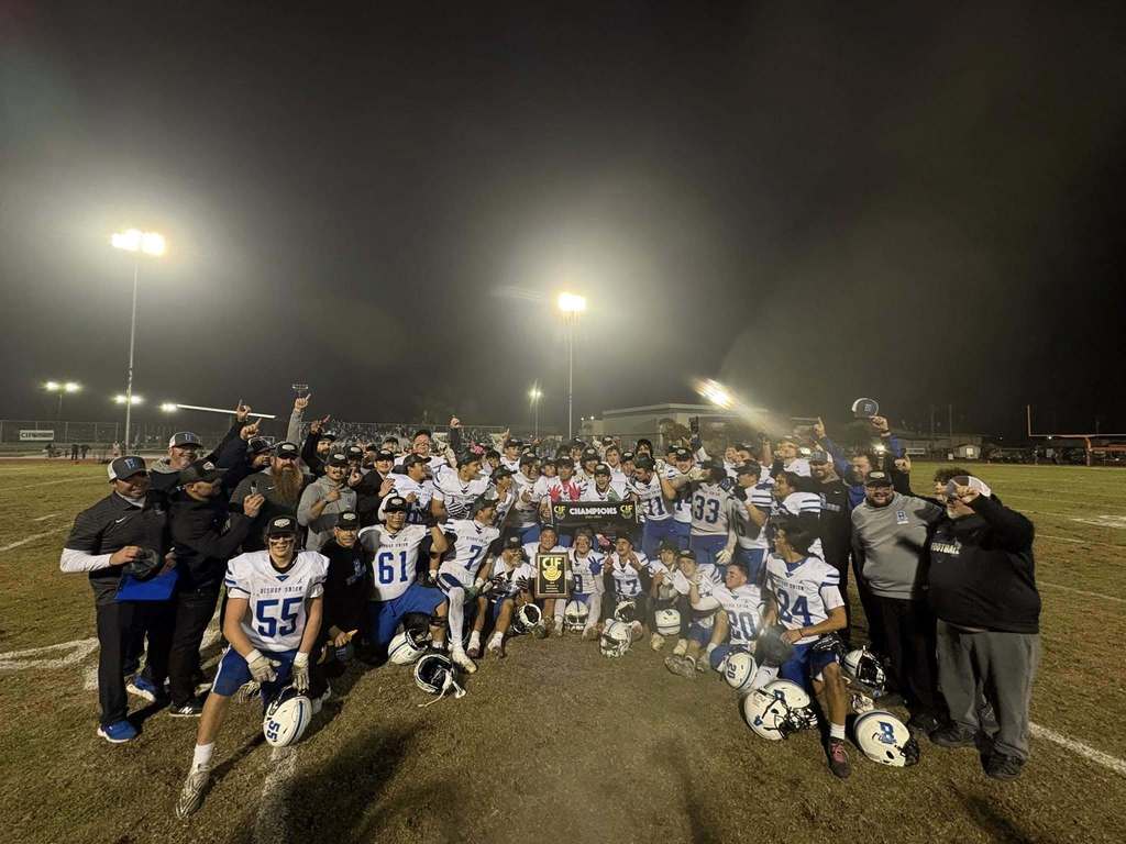BUHS Football team gathered around after their CIF division win