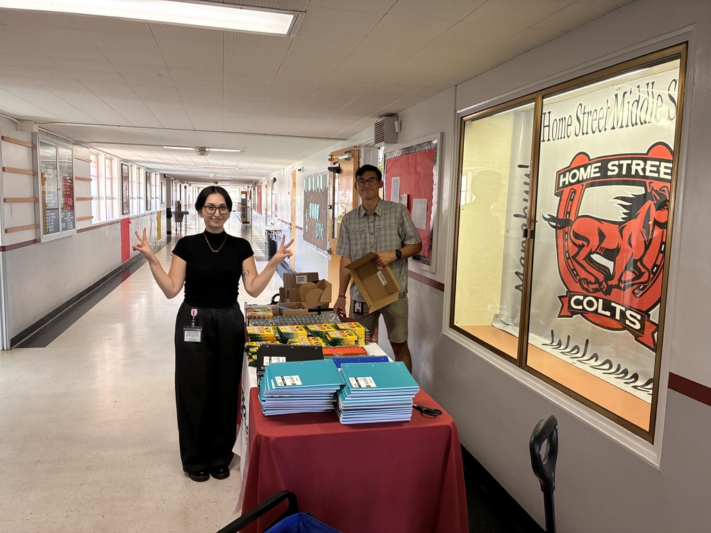 Teachers distribute materials.
