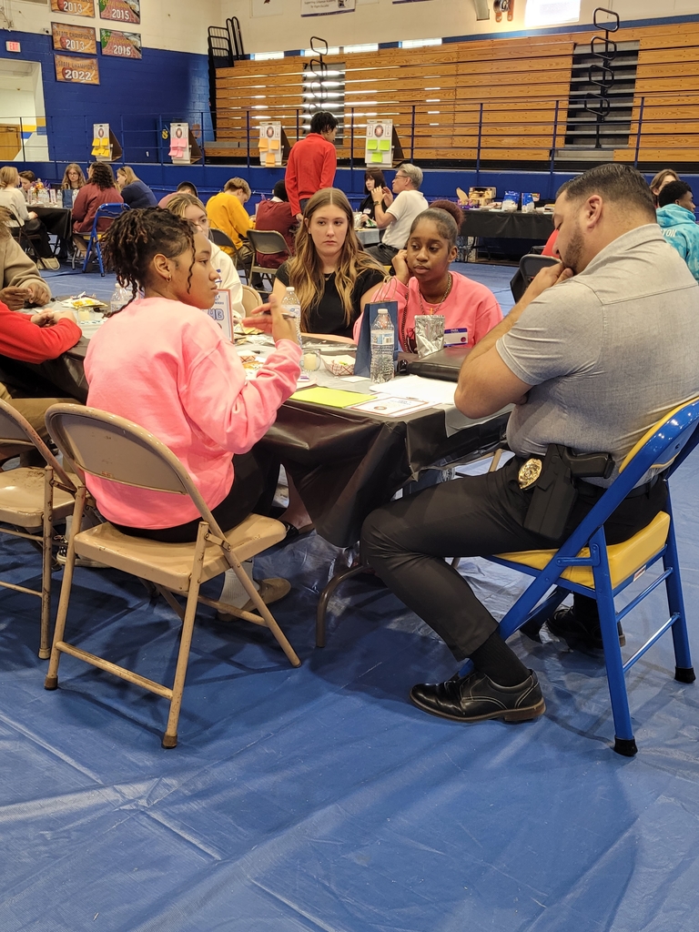 Ella T. listens to a DHS student speak at the symposium.