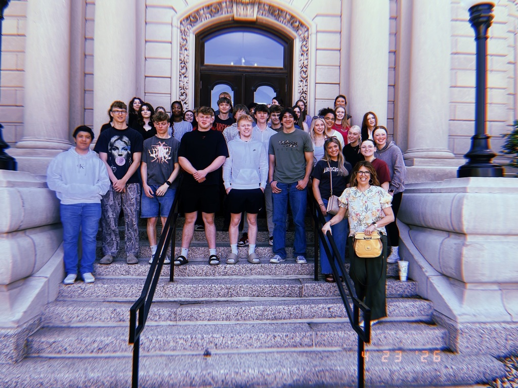 The class on steps of museum