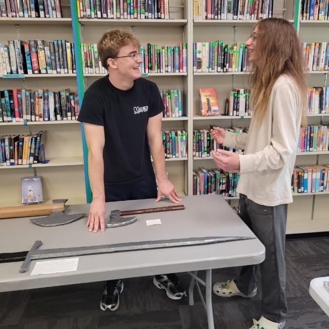 Steven W. and Xzayne E. discuss their projects.