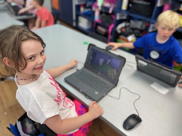 Ophelia and Walker working on Mine craft