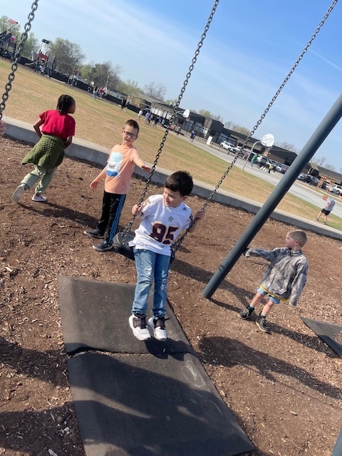 JR. gets a push from a 1st grade friend.