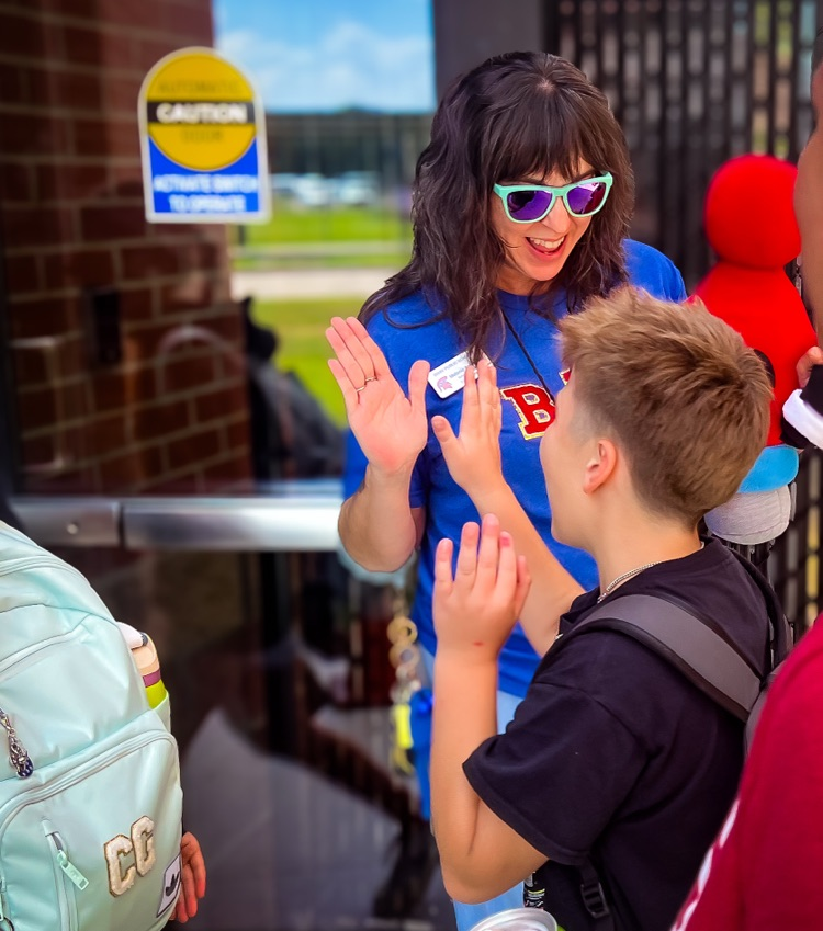 Melanie Ankersheil high-fiving student