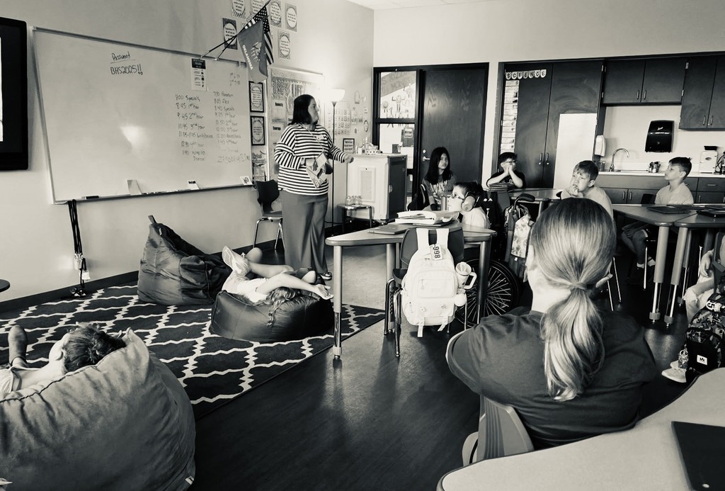 Mrs. Brown reading a book aloud to the class