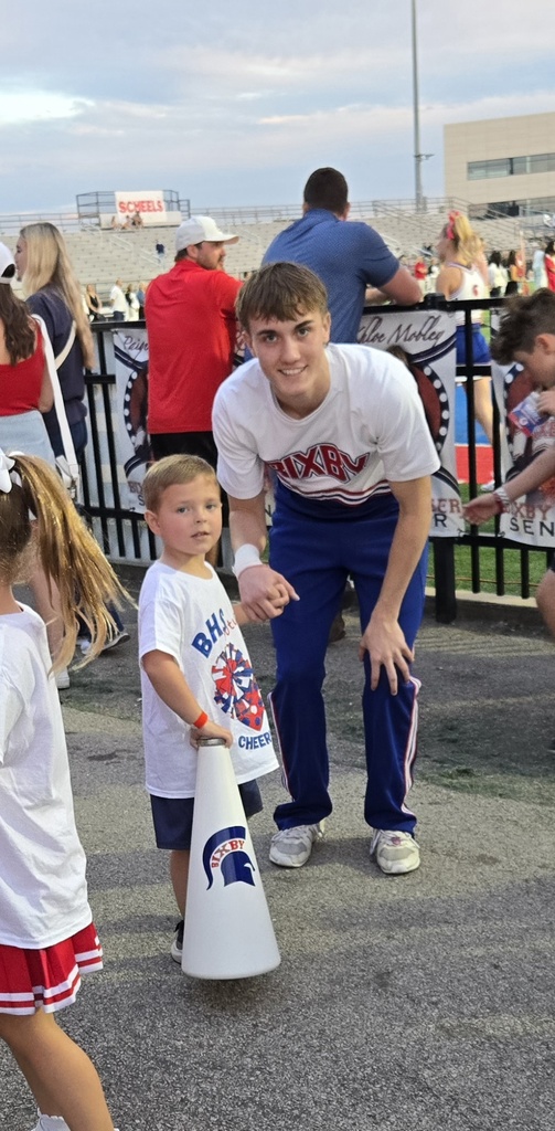 Liam helping the cheerleaders