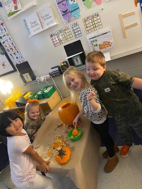 Pumpkin carving in Pre-K, Mrs. Beach