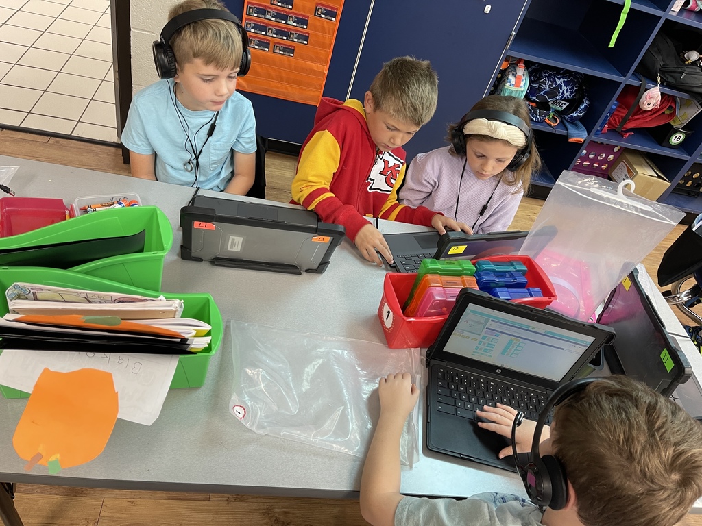 Some of Covey's 3rd graders helping Graves 1st graders with coding. 