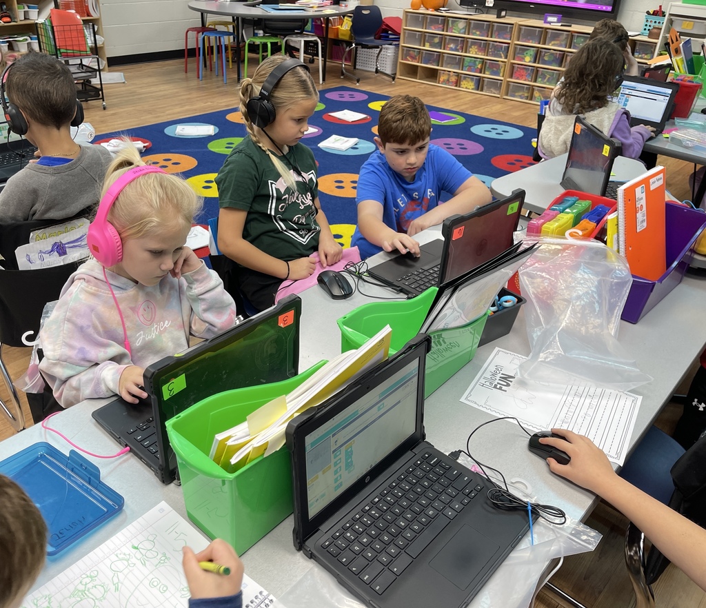Some of Covey's 3rd graders helping Graves 1st graders with coding. 