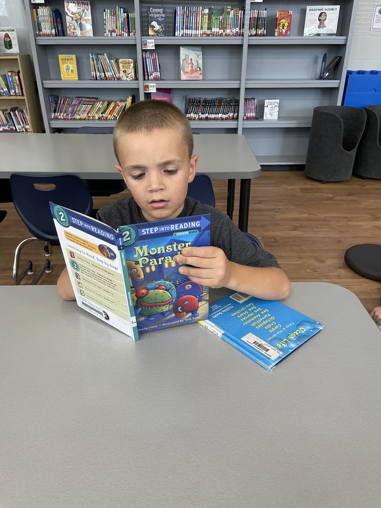 Maxwell reading his book