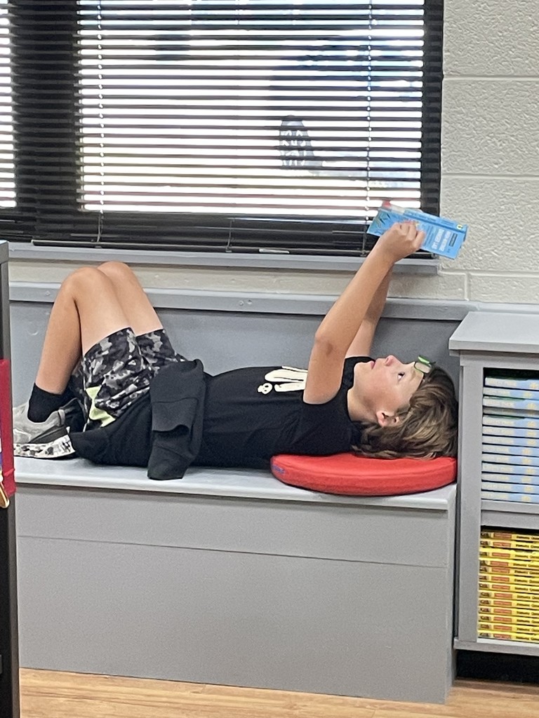 Chilling with his book