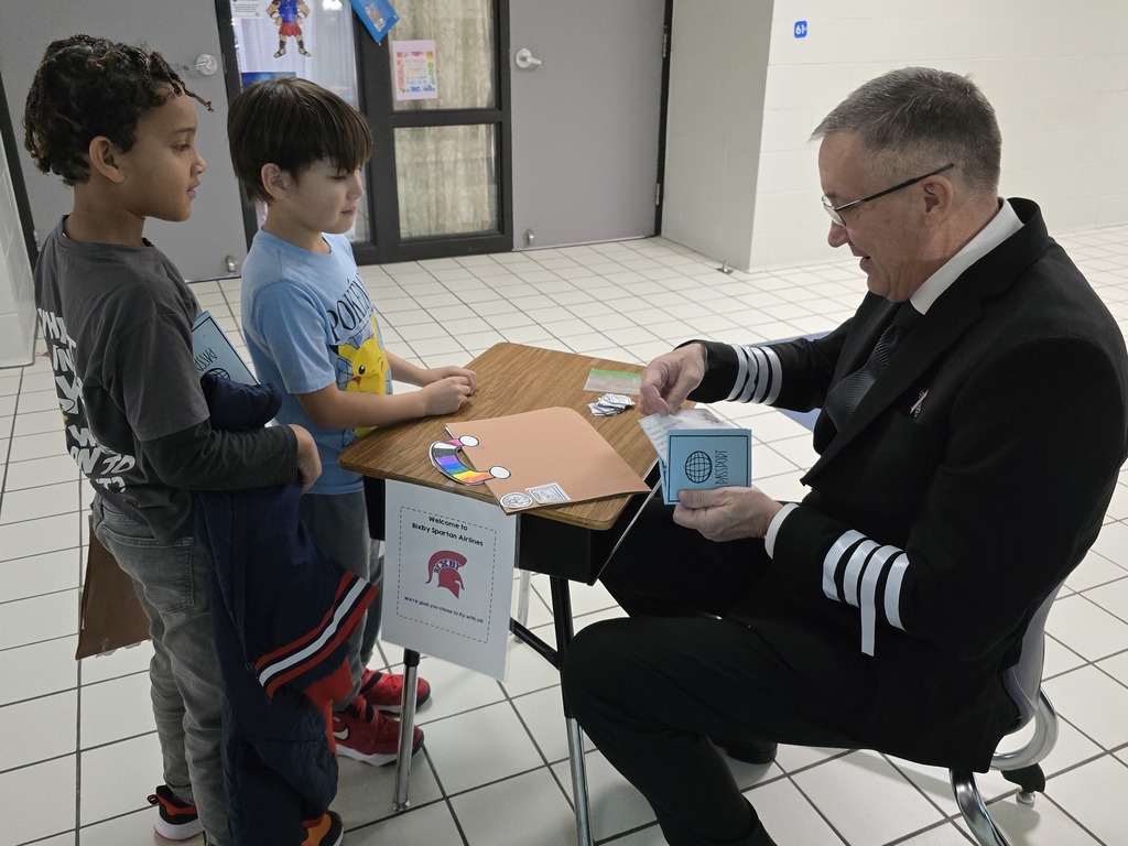 Pilot, Mr. Miller checking in the passengers