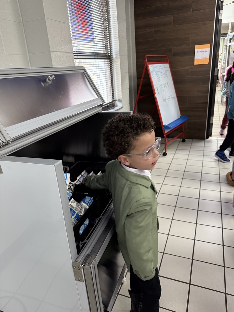 Bryson helping give out milk