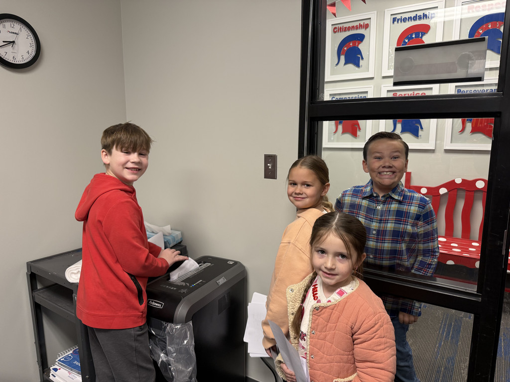 Principal's apprentices shredding documents