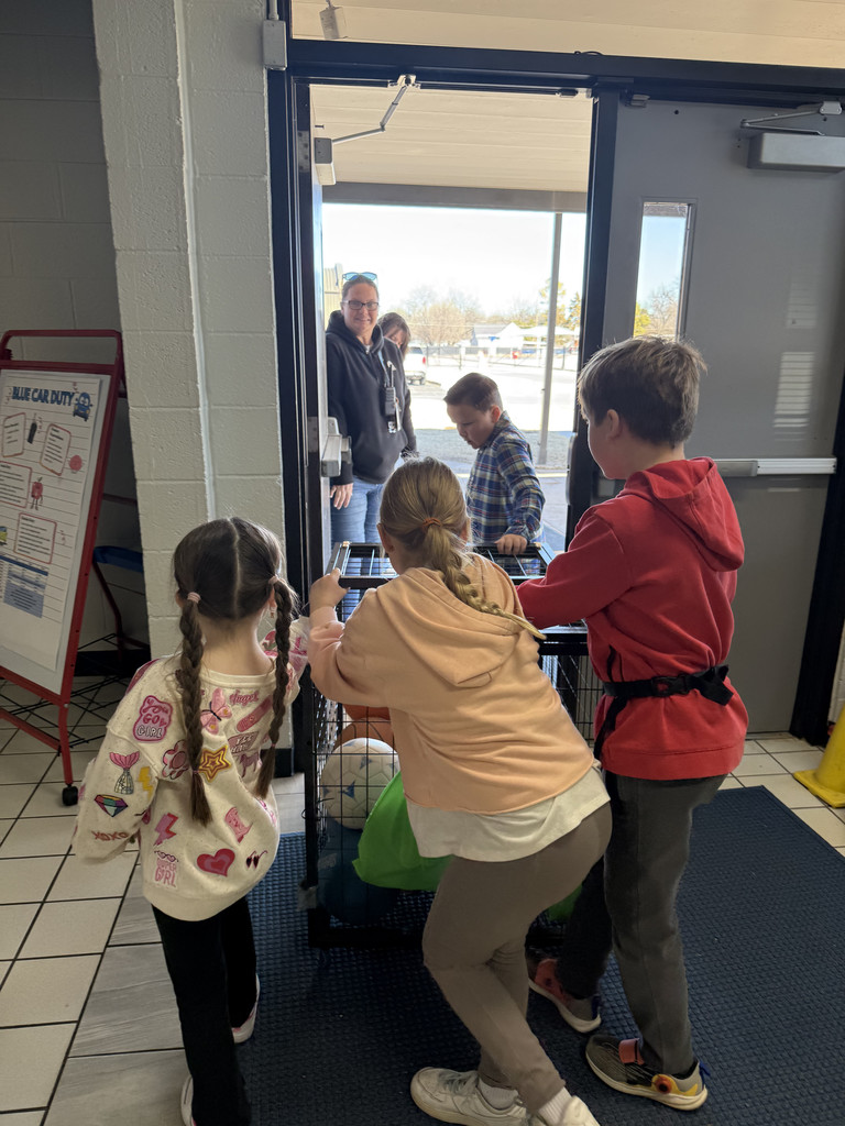 Principla's  apprentices helping take recess ball outside