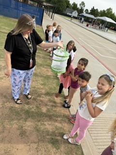 Pre-K letting their butterflies go.